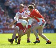 10 July 2005; Brian McGuigan, Tyrone, is tackled by Francie Bellew, Armagh. Bank of Ireland Ulster Senior Football Championship Final, Armagh v Tyrone, Croke Park, Dublin. Picture credit; Ray McManus / SPORTSFILE