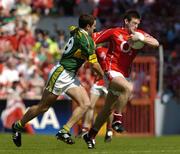 10 July 2005; Derek Kavanagh, Cork, is tackled by Eoin Brosnan, Kerry. Bank of Ireland Munster Senior Football Championship Final, Cork v Kerry, Pairc Ui Chaoimh, Cork. Picture credit; Pat Murphy / SPORTSFILE