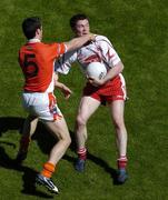 10 July 2005; Enda McGinley, Tyrone, is tackled by Aaron Kernan, Armagh. Bank of Ireland Ulster Senior Football Championship Final, Armagh v Tyrone, Croke Park, Dublin. Picture credit; Brian Lawless / SPORTSFILE