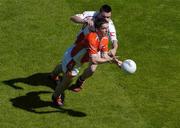 10 July 2005; Brian Mallon, Armagh, is tackled by Ryan McMenamin, Tyrone. Bank of Ireland Ulster Senior Football Championship Final, Armagh v Tyrone, Croke Park, Dublin. Picture credit; Brian Lawless / SPORTSFILE
