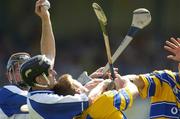 10 July 2005; Waterford's Fergal Hartley catches the sliothar ahead of Clare's Niall Gilligan. Guinness All-Ireland Senior Hurling Championship Qualifier, Round 3, Clare v Waterford, Cusack Park, Ennis, Co. Clare. Picture credit; Damien Eagers / SPORTSFILE