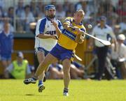 10 July 2005; Clare's Colin Lynch is tackled by Michael Walsh, Waterford. Guinness All-Ireland Senior Hurling Championship Qualifier, Round 3, Clare v Waterford, Cusack Park, Ennis, Co. Clare. Picture credit; Damien Eagers / SPORTSFILE