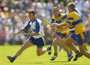 10 July 2005; Eoin McGrath, Waterford, in action against Colin Lynch and Tony Carmody, Clare. Guinness All-Ireland Senior Hurling Championship Qualifier, Round 3, Clare v Waterford, Cusack Park, Ennis, Co. Clare. Picture credit; Damien Eagers / SPORTSFILE