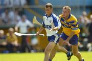 10 July 2005; Eoin McGrath, Waterford, is tackled by Tony Carmody, Clare. Guinness All-Ireland Senior Hurling Championship Qualifier, Round 3, Clare v Waterford, Cusack Park, Ennis, Co. Clare. Picture credit; Damien Eagers / SPORTSFILE