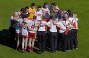 10 July 2005; The Tyrone team form a huddle after the match. Bank of Ireland Ulster Senior Football Championship Final, Armagh v Tyrone, Croke Park, Dublin. Picture credit; Brian Lawless / SPORTSFILE