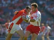 10 July 2005; Steven McDonnell, Tyrone, is tackled by Shane Sweeney, Armagh. Bank of Ireland Ulster Senior Football Championship Final, Armagh v Tyrone, Croke Park, Dublin. Picture credit; Ray McManus / SPORTSFILE