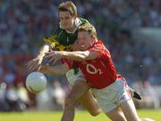 10 July 2005; Eoin Brosnan, Kerry, is tackled by Conor McCarthy, Cork. Bank of Ireland Munster Senior Football Championship Final, Cork v Kerry, Pairc Ui Chaoimh, Cork. Picture credit; Matt Browne / SPORTSFILE