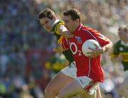 10 July 2005; Eoin Sexton, Cork, is tackled by Eoin Brosnan, Kerry. Bank of Ireland Munster Senior Football Championship Final, Cork v Kerry, Pairc Ui Chaoimh, Cork. Picture credit; Matt Browne / SPORTSFILE