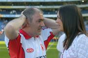 10 July 2005; The Tyrone manager Mickey Harte with his daughter Michaela at the end of the game. Bank of Ireland Ulster Senior Football Championship Final, Armagh v Tyrone, Croke Park, Dublin. Picture credit; Ray McManus / SPORTSFILE