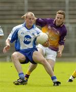 9 July 2005; Dick Clerkin, Monaghan, in action against Kieran Kennedy, Wexford. Bank of Ireland All-Ireland Senior Football Championship Qualifier, Round 2, Monaghan v Wexford, St. Tighernach's Park, Clones, Co. Monaghan. Picture credit; Pat Murphy / SPORTSFILE