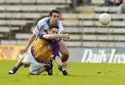 9 July 2005; Padraig Curtis, Wexford, in action against Paul Finlay, Monaghan. Bank of Ireland All-Ireland Senior Football Championship Qualifier, Round 2, Monaghan v Wexford, St. Tighernach's Park, Clones, Co. Monaghan. Picture credit; Pat Murphy / SPORTSFILE