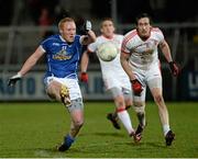 19 February 2014; Cian Mackey, Cavan, in action against Colm Cavanagh, Tyrone. Power NI Dr. McKenna Cup Final, Cavan v Tyrone, Athletic Grounds, Armagh. Picture credit: Oliver McVeigh / SPORTSFILE