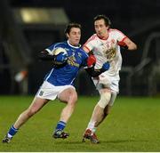 19 February 2014; Damien O'Reilly, Cavan, in action against Colm Cavanagh, Tyrone. Power NI Dr. McKenna Cup Final, Cavan v Tyrone, Athletic Grounds, Armagh. Picture credit: Oliver McVeigh / SPORTSFILE