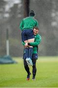 20 February 2014; Ireland's Brian O'Driscoll lifts Paddy Jackson during a warm-up drill at squad training ahead of their RBS Six Nations Rugby Championship match against England on Saturday. Ireland Rugby Squad Training, Carton House, Maynooth, Co. Kildare. Picture credit: Stephen McCarthy / SPORTSFILE