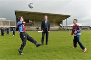 20 February 2014; Republic of Ireland manager Martin O'Neill with Lisnagry FC players Brian Murphy, aged 12, left, and Adrian Kelleher, aged 11, during a visit to the Markets Field Project, Markets Field, Garryowen, Limerick. Picture credit: Diarmuid Greene / SPORTSFILE