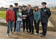 20 February 2014; Republic of Ireland manager Martin O'Neill presents match tickets to Shane O'Donnell, aged 14, left, and Dale Hannon, aged 14, from Ballinacurra Weston, Limerick, along with Garda Adrian Healy, Garda  Niamh Briggs, FAI development officer Barbara Bermingham, and Sergeant Mick Nash during a visit to the Markets Field Project. Markets Field, Garryowen, Limerick. Picture credit: Diarmuid Greene / SPORTSFILE