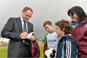20 February 2014; Republic of Ireland manager Martin O'Neill signs an autograph for Lee Park, aged 11, from Castleconnell, Limerick, during a visit to the Markets Field Project. Markets Field, Garryowen, Limerick. Picture credit: Diarmuid Greene / SPORTSFILE