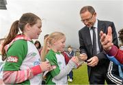 20 February 2014; Republic of Ireland manager Martin O'Neill signs autographs for Candice Clancy, aged 10, left, and Abbie Porter, aged 7, from Castleconnell, Limerick during a visit to the Markets Field Project. Markets Field, Garryowen, Limerick. Picture credit: Diarmuid Greene / SPORTSFILE