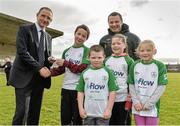 20 February 2014; Republic of Ireland manager Martin O'Neill presents match tickets to, from left to right, Lee Park, aged 11, Ronan Clancy, aged 7, Candice Clancy, aged 10, and Abbie Porter, aged 7, all from Castleconnell, along with Conor Nestor, FAI development officer for County Limerick, during a visit to the Markets Field Project. Markets Field, Garryowen, Limerick. Picture credit: Diarmuid Greene / SPORTSFILE
