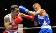 21 February 2014; Sean Duffy, left, Holy Trinity boxing club, exchanges punches with Paul Hyland, Gleann boxing club, during their 64kg bout. National Senior Boxing Championships, First Round, National Stadium, Dublin. Picture credit: David Maher / SPORTSFILE