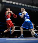 21 February 2014; Michael Nevin, left, Portlaoise boxing club, exchanges punches with Niall Murray, Gorey boxing club, during their 64kg bout. National Senior Boxing Championships, First Round, National Stadium, Dublin. Picture credit: David Maher / SPORTSFILE