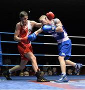 21 February 2014; Michael Nevin, left, Portlaoise boxing club, exchanges punches with Niall Murray, Gorey boxing club, during their 64kg bout. National Senior Boxing Championships, First Round, National Stadium, Dublin. Picture credit: David Maher / SPORTSFILE