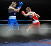 21 February 2014; Ciaran Bates, right, St.Mary's boxing club, Dublin, exchanges punches with Dean O'Gorman, Carrick on Suir boxing club, during their 64kg bout. National Senior Boxing Championships, First Round, National Stadium, Dublin. Picture credit: David Maher / SPORTSFILE