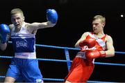 21 February 2014; Dean Walsh, left, St Ibars and St Joseph's boxing club, exchanges punches with Jason Conroy, Crumlin boxing club, during their 64kg bout. National Senior Boxing Championships, First Round, National Stadium, Dublin. Picture credit: David Maher / SPORTSFILE