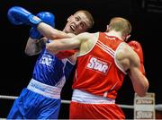 21 February 2014; Dean Walsh, left, St Ibar's and St Joseph's boxing club, exchanges punches with Jason Conroy, Crumlin boxing club, during their 64kg bout. National Senior Boxing Championships, First Round, National Stadium, Dublin. Picture credit: David Maher / SPORTSFILE
