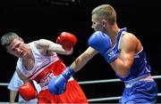 21 February 2014; Johnny Harty, left, Rathkeale boxing club, exchanges punches with Brian Brosnan, Olympic boxing club, during their 69kg bout. National Senior Boxing Championships, First Round, National Stadium, Dublin. Picture credit: David Maher / SPORTSFILE