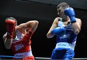 21 February 2014; Petru Ursu, left, Lucan boxing club, exchanges punches with David Roche, Riverstown boxing club, during their 69kg bout. National Senior Boxing Championships, First Round, National Stadium, Dublin. Picture credit: David Maher / SPORTSFILE