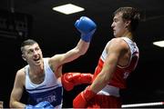 21 February 2014; Petru Ursu, right, Lucan boxing club, exchanges punches with David Roche, Riverstown boxing club, during their 69kg bout. National Senior Boxing Championships, First Round, National Stadium, Dublin. Picture credit: David Maher / SPORTSFILE
