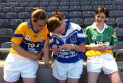 11 July 2005; Players Noreen Devery, Clare, left and Luchelle Claffey, Waterford view their photographs as Offaly's Clodagh Sullivan looks on at the launch of the 2005 TG4 All-Ireland Ladies Football Championship. Croke Park, Dublin. Picture credit; Damien Eagers / SPORTSFILE
