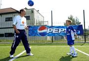 12 July 2005; Republic of Ireland manager Brian Kerr with 7 year old Gary O'Connor, winner of the FAI Pepsi Summer Soccer School Dream Prize to train with Real Madrid's David Beckham in London. Templeogue FC, Tymon Park, Templeogue, Dublin. Picture credit; Pat Murphy / SPORTSFILE
