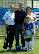 12 July 2005; Republic of Ireland manager Brian Kerr with 7 year old Gary O'Connor, winner of the FAI Pepsi Summer Soccer School Dream Prize to train with Real Madrid's David Beckham in London, and his parents Karen and Toni. Templeogue FC, Tymon Park, Templeogue, Dublin. Picture credit; Pat Murphy / SPORTSFILE