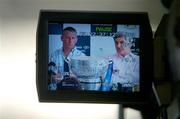 12 July 2005; Dublin manager Paul Caffrey, left, and Laois manager Mick O'Dwyer with the Delaney Cup pictured through the viewfinder of a tv camera at a photocall ahead of this weekend's Bank of Ireland Leinster Senior Football Championship Final. Bank Of Ireland Head Office, Lower Baggot St, Dublin. Picture credit; Ciara Lyster / SPORTSFILE