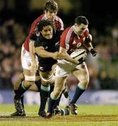 9 July 2005; Stephen Jones, British and Irish Lions, is tackled by Rodney So'oialo, New Zealand. British and Irish Lions Tour to New Zealand 2005, 3rd Test, New Zealand v British and Irish Lions, Eden Park, Auckland, New Zealand. Picture credit; Brendan Moran / SPORTSFILE