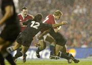 9 July 2005; Josh Lewsey, British and Irish Lions, is tackled by Tana Umaga (12) and Rico Gear, New Zealand. British and Irish Lions Tour to New Zealand 2005, 3rd Test, New Zealand v British and Irish Lions, Eden Park, Auckland, New Zealand. Picture credit; Brendan Moran / SPORTSFILE