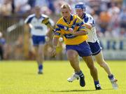 10 July 2005; Tony Carmody, Clare, in action against John Mullane, Waterford. Guinness All-Ireland Senior Hurling Championship Qualifier, Round 3, Clare v Waterford, Cusack Park, Ennis, Co. Clare. Picture credit; Damien Eagers / SPORTSFILE