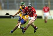 13 July 2005; Maurice O'Sullivan, Cork, in action against Brendan Bugler, Clare. Erin Munster Under 21 Hurling Championship Semi-final, Clare v Cork, Semple Stadium, Thurles, Co. Tipperary. Picture credit; Matt Browne / SPORTSFILE