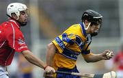 13 July 2005; Darragh Clancy, Clare, in action against Brendan Barry, Cork. Erin Munster Under 21 Hurling Championship Semi-final, Clare v Cork, Semple Stadium, Thurles, Co. Tipperary. Picture credit; Matt Browne / SPORTSFILE
