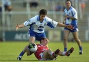 16 July 2005; Simon Gerard, Louth, is tackled by Damien Freeman, Monaghan. Bank of Ireland All-Ireland Senior Football Championship Qualifier, Round 3, Louth v Monaghan, Kingspan Breffni Park, Cavan. Picture credit; Damien Eagers / SPORTSFILE