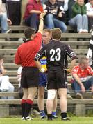 17 July 2005; Ronan Slattery, Clare, partially hidden, is sent off by referee Maurice Deegan. Bank of Ireland All-Ireland Senior Football Championship Qualifier, Round 3, Sligo v Clare, McHale Park, Castlebar, Co. Mayo. Picture credit; Pat Murphy / SPORTSFILE