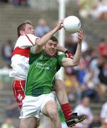 17 July 2005; Conor Mullane, Limerick, contests a ball with Paul Murphy, Derry. Bank of Ireland All-Ireland Senior Football Championship Qualifier, Round 3, Derry v Limerick, McHale Park, Castlebar, Co. Mayo. Picture credit; Pat Murphy / SPORTSFILE