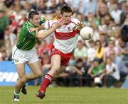 17 July 2005; Eoin Bradley, Derry, is tackled by Stephen Lucey, Limerick. Bank of Ireland All-Ireland Senior Football Championship Qualifier, Round 3, Derry v Limerick, McHale Park, Castlebar, Co. Mayo. Picture credit; Pat Murphy / SPORTSFILE
