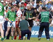17 July 2005; Referee John Bannon receives treatment during the game before being replaced at half time. Bank of Ireland All-Ireland Senior Football Championship Qualifier, Round 3, Derry v Limerick, McHale Park, Castlebar, Co. Mayo. Picture credit; Pat Murphy / SPORTSFILE
