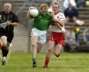 17 July 2005; Stephen Kelly, Limerick, is tackled by Patsy Bradley, Derry. Bank of Ireland All-Ireland Senior Football Championship Qualifier, Round 3, Derry v Limerick, McHale Park, Castlebar, Co. Mayo. Picture credit; Pat Murphy / SPORTSFILE