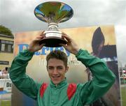 17 July 2005; Christophe Soumillon, jockey, lifts the trophy after winning the Darley Irish Oaks on Shawanda. Curragh Racecourse, Co. Kildare. Picture credit; Matt Browne / SPORTSFILE