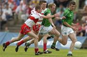 17 July 2005; Stehen Kelly, Limerick, in action against Francis McEldowney and Mark Lynch, back, Derry. Bank of Ireland All-Ireland Senior Football Championship Qualifier, Round 3, Derry v Limerick, McHale Park, Castlebar, Co. Mayo. Picture credit; Pat Murphy / SPORTSFILE