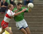 17 July 2005; John Galvin, Limerick, is tackled by Patsy Bradley, Derry. Bank of Ireland All-Ireland Senior Football Championship Qualifier, Round 3, Derry v Limerick, McHale Park, Castlebar, Co. Mayo. Picture credit; Pat Murphy / SPORTSFILE